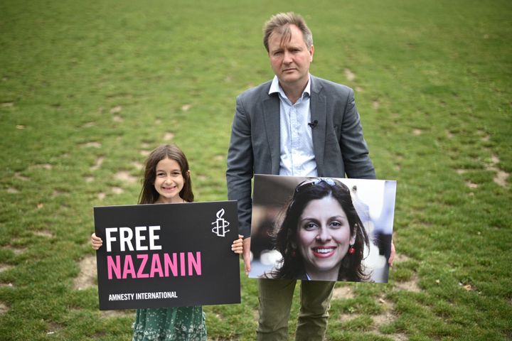Ratcliffe and Gabriella pose with placards of Zaghari-Ratcliffe at an event in Parliament Square, London to mark the 2,000th day of her detention last September.