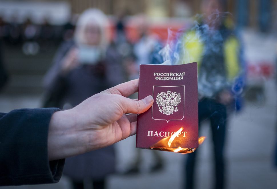 Anna Jakubova set fire to her Russian passport during the Standing In Solidarity With Ukraine vigil in Edinburgh. 