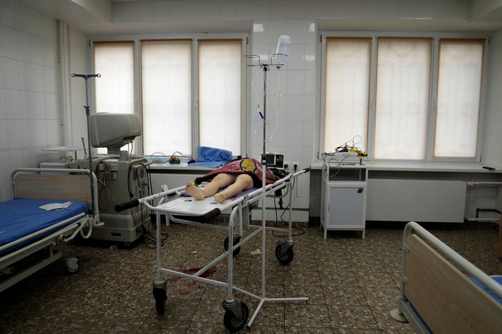 The lifeless body of a girl killed during shelling at a residential area lies on a medical cart at the city hospital of Mariupol, eastern Ukraine, on Feb. 27, 2022. 