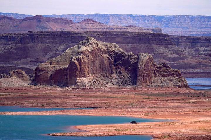 FILE - Low water levels at Wahweap Bay at Lake Powell along the Upper Colorado River Basin are shown Wednesday, June 9, 2021, at the Utah and Arizona border at Wahweap, Ariz. (AP Photo/Ross D. Franklin,File)