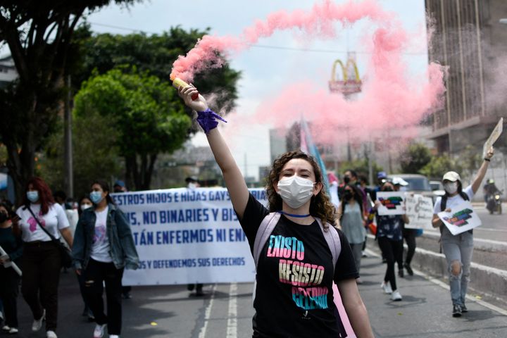 People take part in "The March Against Hate" in Guatemala City on March 12 following the law's passage. 