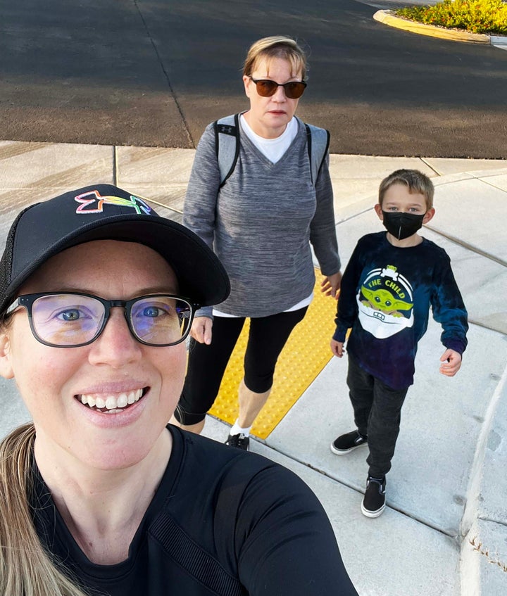 The mother of two, seen here with her mother and oldest son, continues to undergo testing to better understand her long COVID struggle
