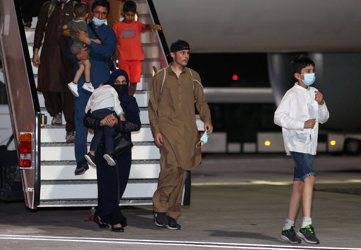 Evacuees from Afghanistan arrive at Hamad International Airport in Doha, Qatar, on Sept. 10, 2021.