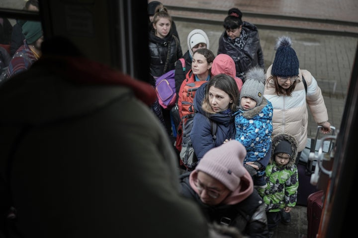 Women and children in Chop, Ukraine board a humanitarian train organised by the Slovak Rail Company to bring refugees to Kosice, Slovakia on March 16, 2022.