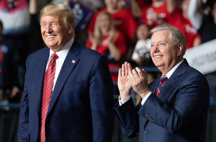 Then President Donald Trump and Sen. Lindsey Graham in February 2020. 