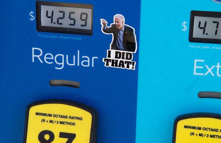 An Arlington, Virginia, gas pump displays recent fuel prices, along with a sticker of Biden. Republicans are eager to pin the blame on the president for rising gas prices.
