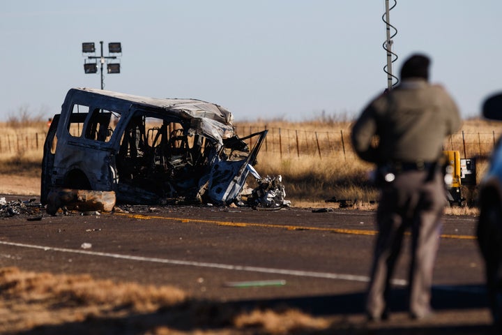 Texas Department of Public Safety Troopers look over the scene of a fatal car wreck early Wednesday.