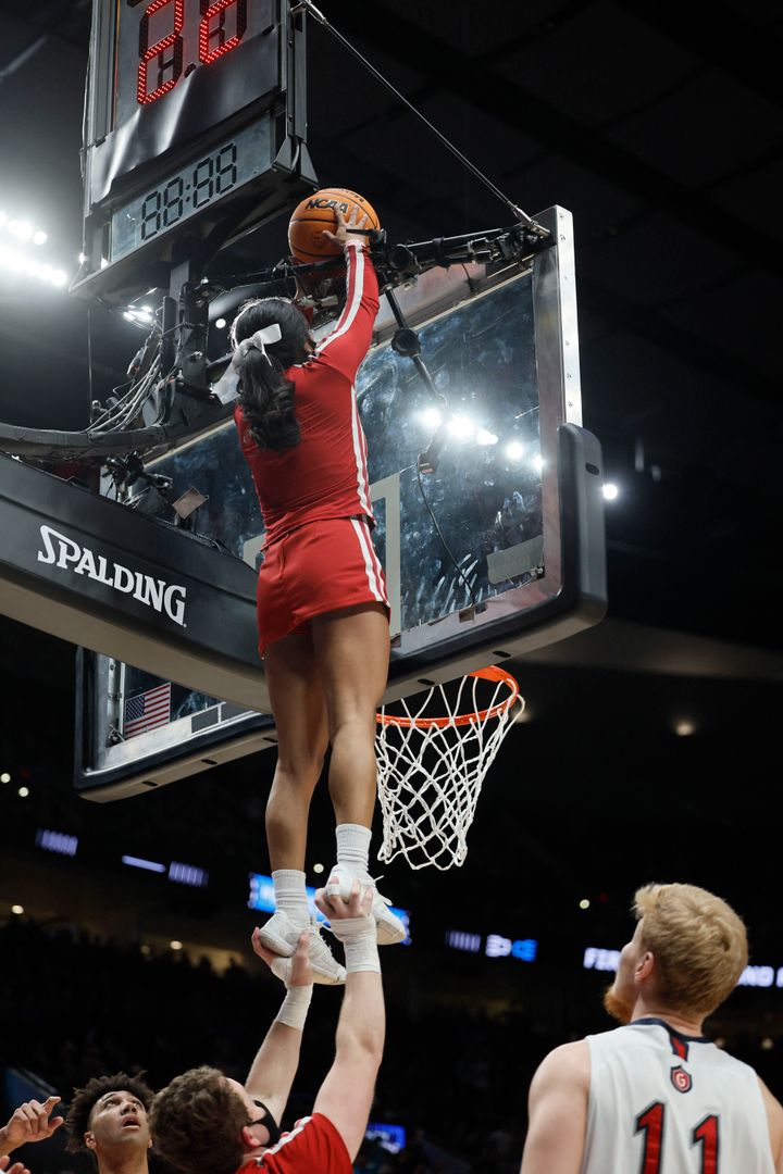 Indiana Hoosiers cheerleaders retrieves the basketball in the match-up against the Saint Mary's Gaels during the first round of the 2022 NCAA Tournament at Moda Center. 