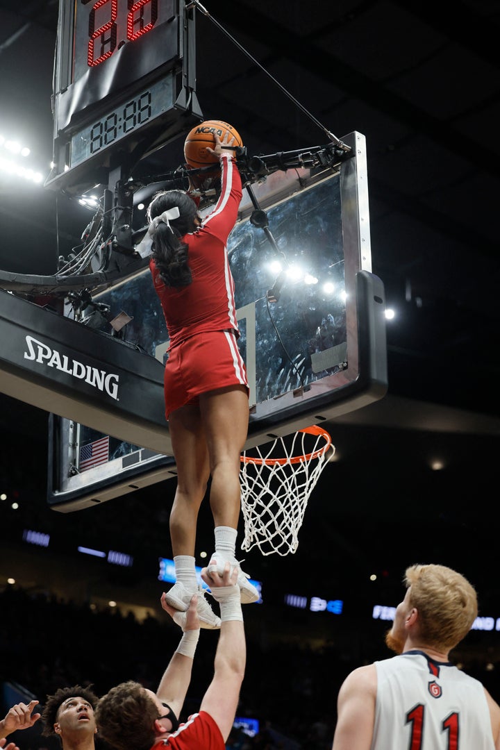 Indiana Hoosiers cheerleaders retrieves the basketball in the match-up against the Saint Mary's Gaels during the first round of the 2022 NCAA Tournament at Moda Center.