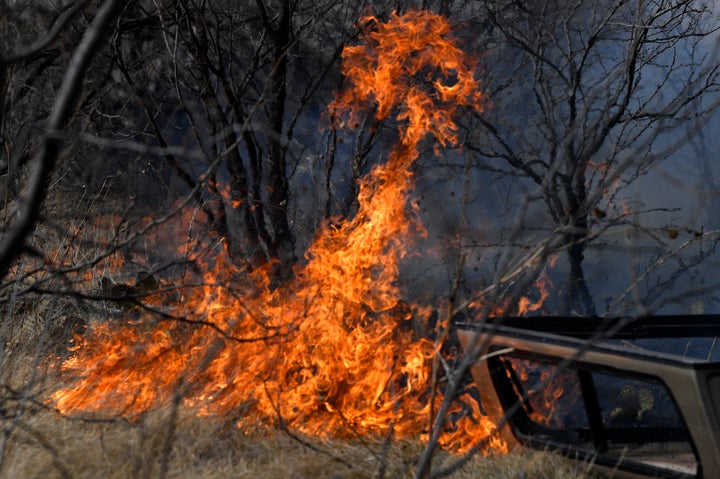 Flames quickly spread through dry grass west of Abilene, Texas near Old Highway 80 Thursday, March 17, 2022.