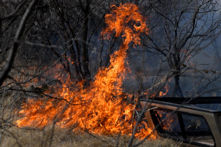 Flames quickly spread through dry grass west of Abilene, Texas near Old Highway 80 Thursday, March 17, 2022. 