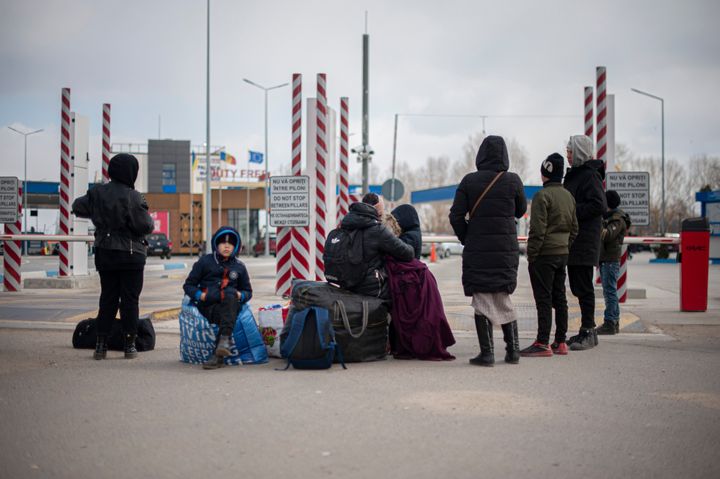 Ukrainian women and children, escaped from the war, after crossing the border with Moldova, waiting to be transported to a reception centre. Palanca, territorial border between Moldova and Ukraine on 18 March, 2022. (Photo by Andrea Mancini/NurPhoto via Getty Images)