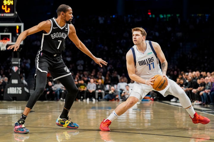 Dallas Mavericks guard Luka Doncic pictured with Brooklyn Nets forward Kevin Durant in the first half of an NBA game on March 16, 2022, in Brooklyn, New York.