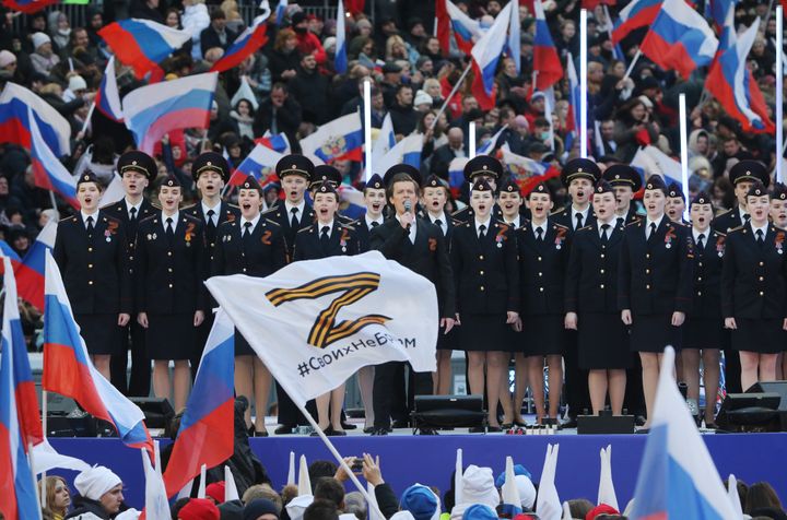 A military choir performs during a rally on March 18 in Moscow. Thousands of people gathered at Luzhniki Stadium to show support for Russian President Vladimir Putin.