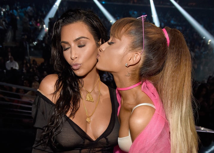Kim Kardashian and Ariana Grande pose together at the 2016 MTV Video Music Awards.