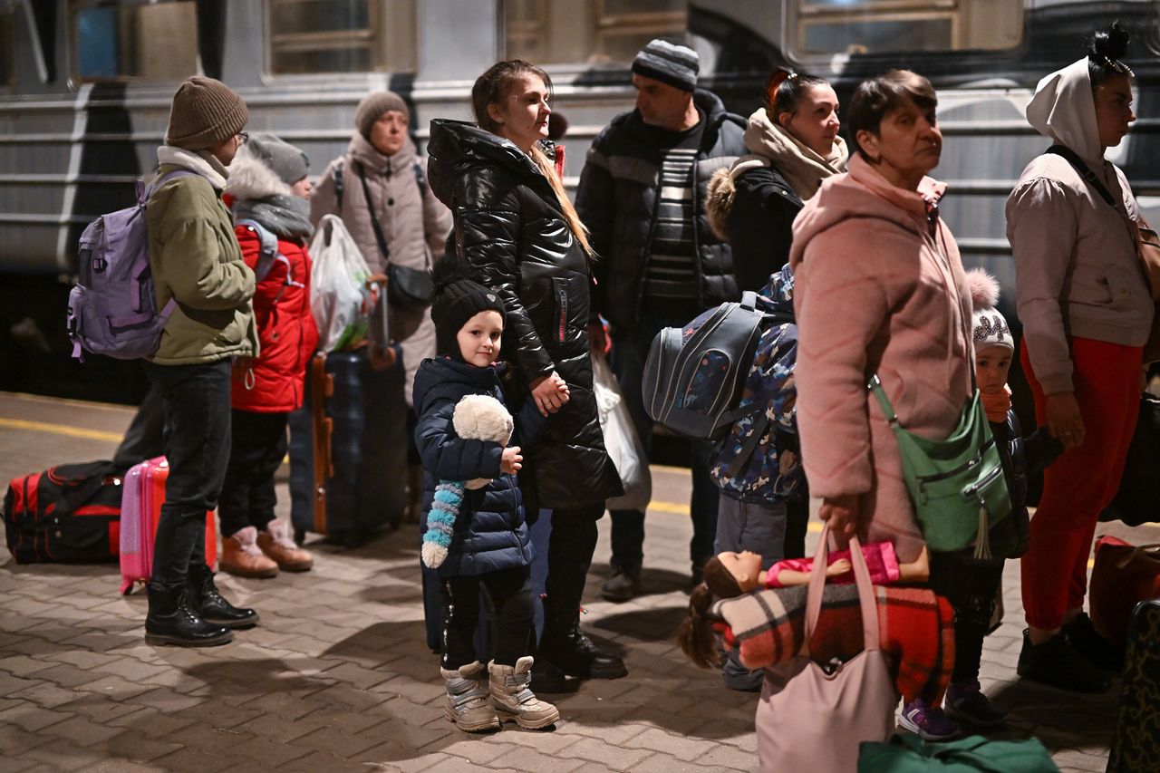 People, mainly women and children, arrive at Przemysl train station from war-torn Ukraine.
