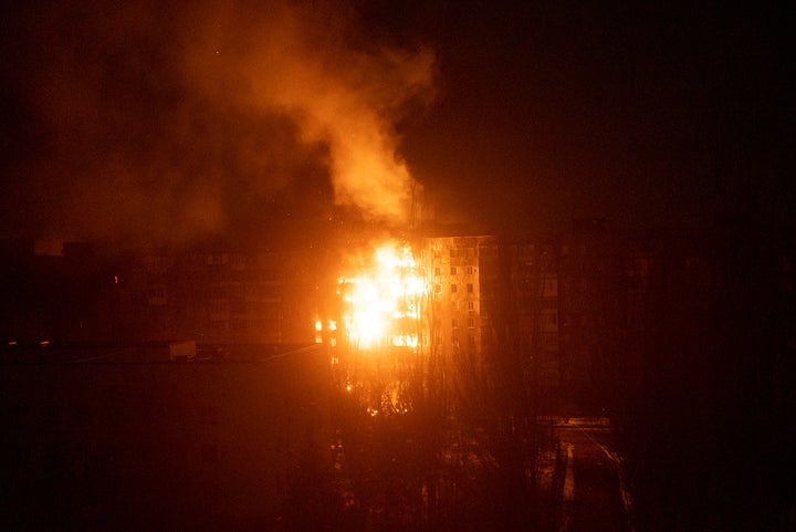 A fire burns at an apartment building after it was hit by shelling in Mariupol, Ukraine, Friday, March 11, 2022.