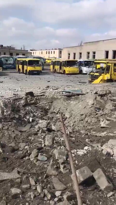 A screen grab captured from a video shows destroyed buildings and vehicles after Russian attacks in Mariupol, Ukraine on March 21, 2022.