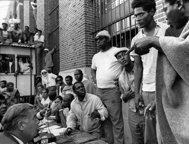 In this file photo of Sept. 10, 1971, inmates of Attica state prison (right) negotiate with New York prisons commissioner Russell Oswald (lower left) at the maximum-security prison where inmates had taken control in rural western New York.