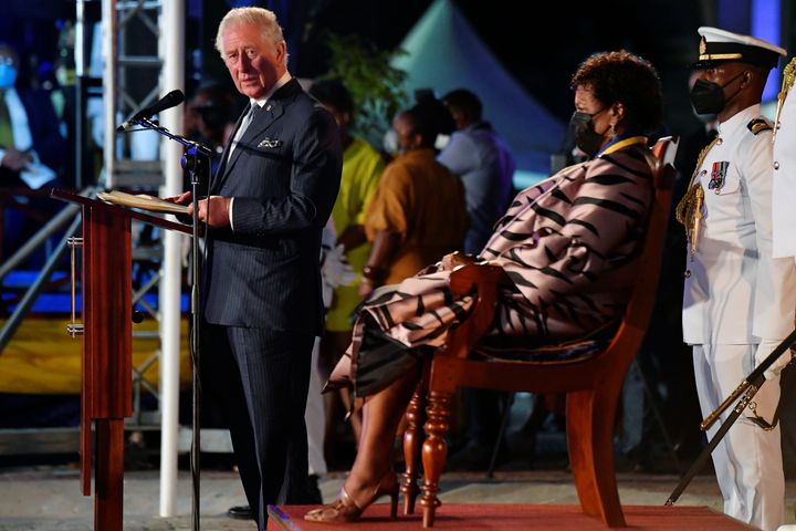 Prince Charles speaks as the president of Barbados, Dame Sandra Mason, looks on during her inauguration on Nov. 30, 2021, in Bridgetown, Barbados.