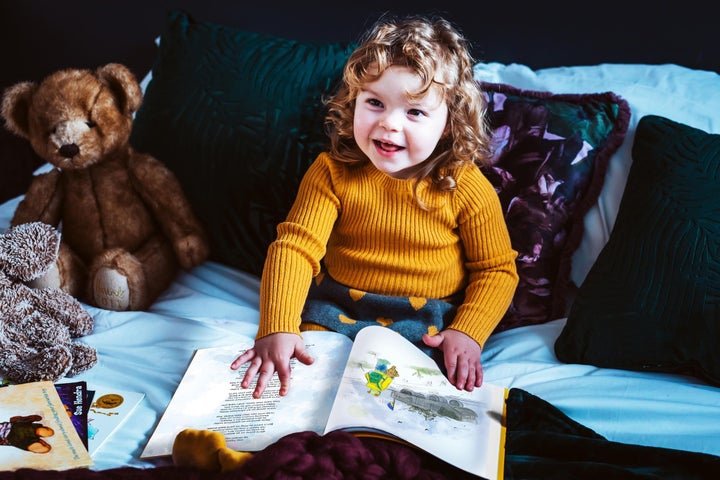 Abigail's daughter Polly reading War Teddies.