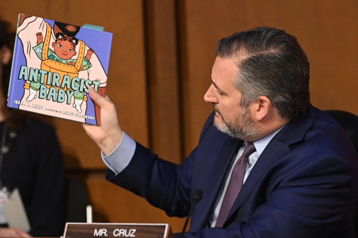 Sen. Ted Cruz (R-Texas) holds a book titled "Antiracist Baby" while speaking during the confirmation hearing for Judge Ketanji Brown Jackson, a nominee to the U.S. Supreme Court.