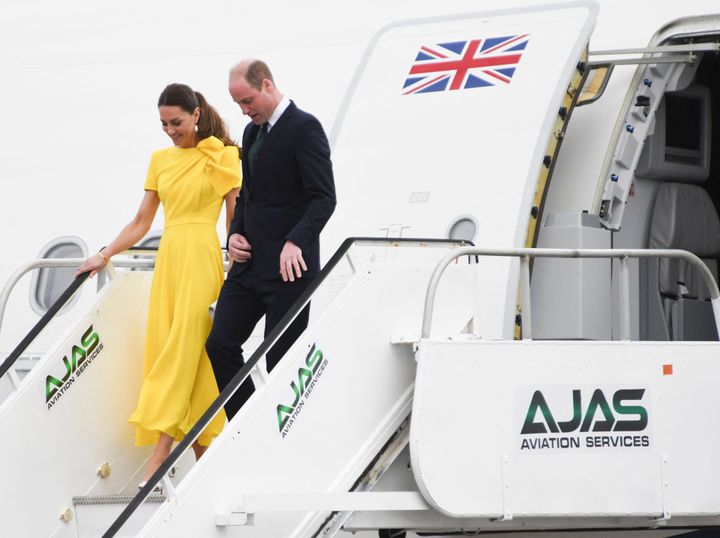 Prince William and his wife Catherine step off the plane upon arrival at the Norman Manley International Airport in Kingston as they visit Jamaica.