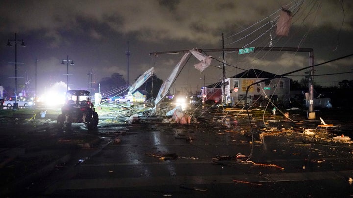 A street in New Orleans' Lower 9th Ward is covered in debris Tuesday after severe storms moved through the area.