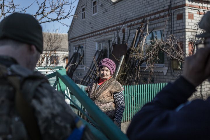 A woman is seen in the Ukrainian village of Kamiyanske, about 30km from Zaporizhzhia and one of the most bombed in the area