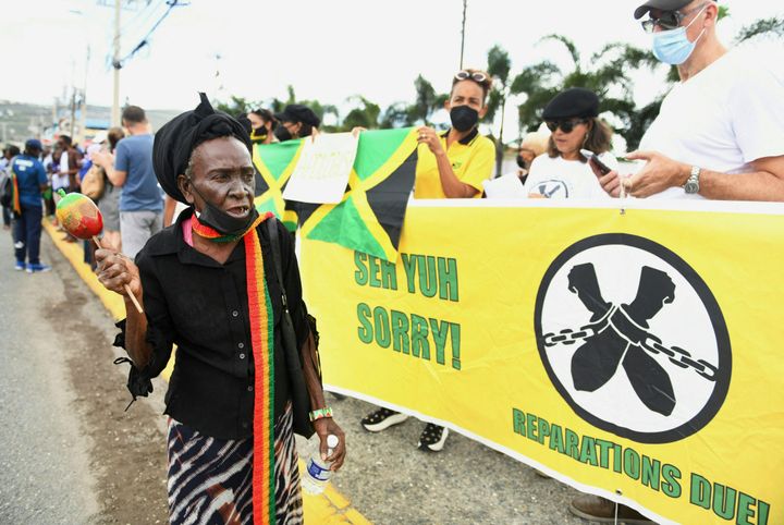 People calling for slavery reparations, protest outside the entrance of the British High Commission during the visit of the Duke and Duchess of Cambridge in Kingston, Jamaica on March 22.