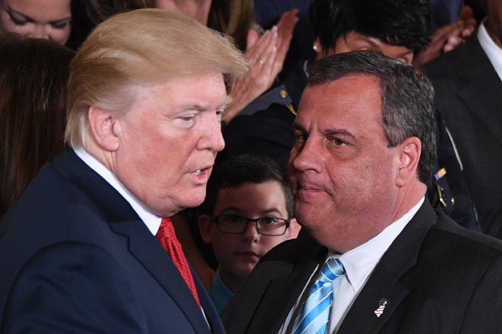 Then-President Donald Trump (left) speaks with then-Gov. Chris Christie (R-N.J.) after he delivered remarks on combatting drug demand and the opioid crisis on Oct. 26, 2017 in the East Room of the White House in Washington, D.C.