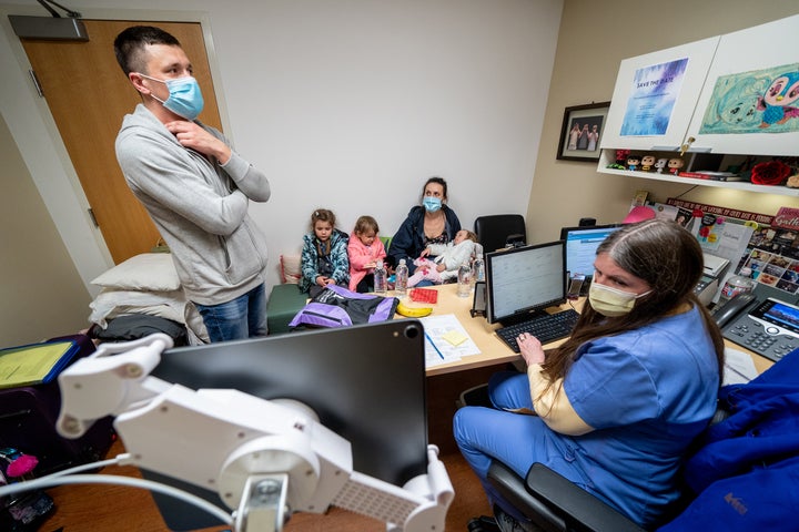 A young Ukrainian cancer patient is seen following her arrival at St. Jude Children's Research Hospital with her family. 