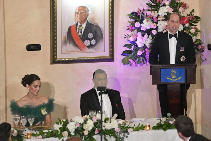 The Duchess of Cambridge and Prime Minister of Jamaica Andrew Holness watch as Prince William, Duke of Cambridge speaks on stage during a dinner hosted by the Governor General of Jamaica at King's House on March 23.