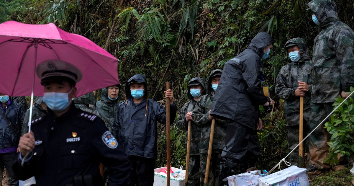 China Plane Crash: Searchers Find Wing, Engine Parts