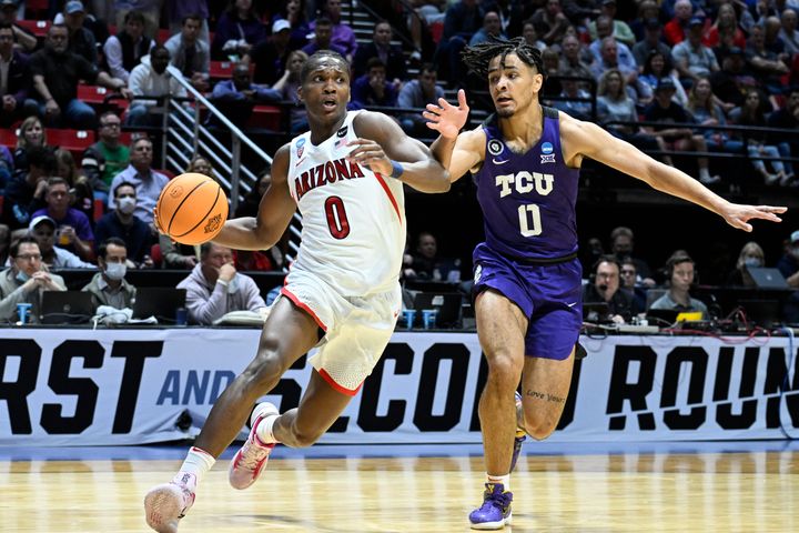 Arizona guard Bennedict Mathurin drives on TCU's Micah Peavy during the Wildcats' NCAA tournament victory on Sunday.