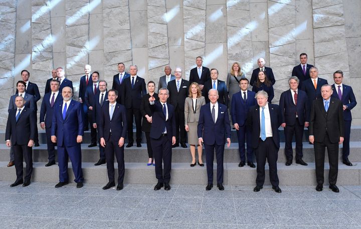 U.S. President Joe Biden takes a family photo with other NATO leaders at NATO Headquarters in Brussels on March 24, 2022. 