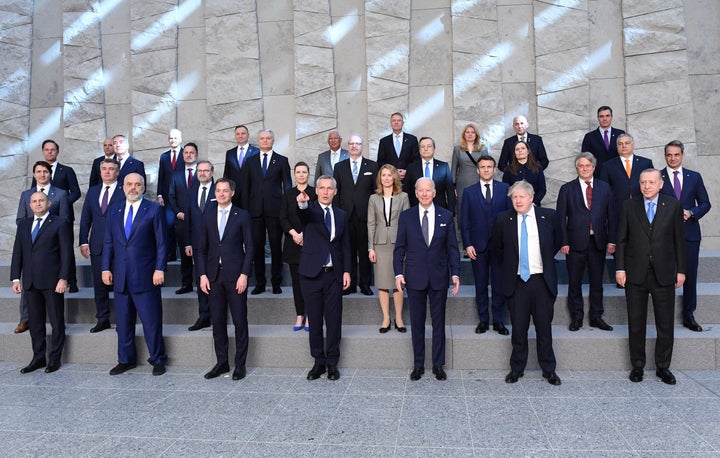 U.S. President Joe Biden takes a family photo with other NATO leaders at NATO Headquarters in Brussels on March 24, 2022.