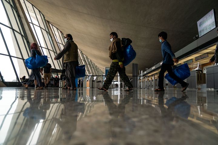 Evacuees who fled Afghanistan arrive in the U.S. at Dulles International Airport in Virginia, Aug. 31.