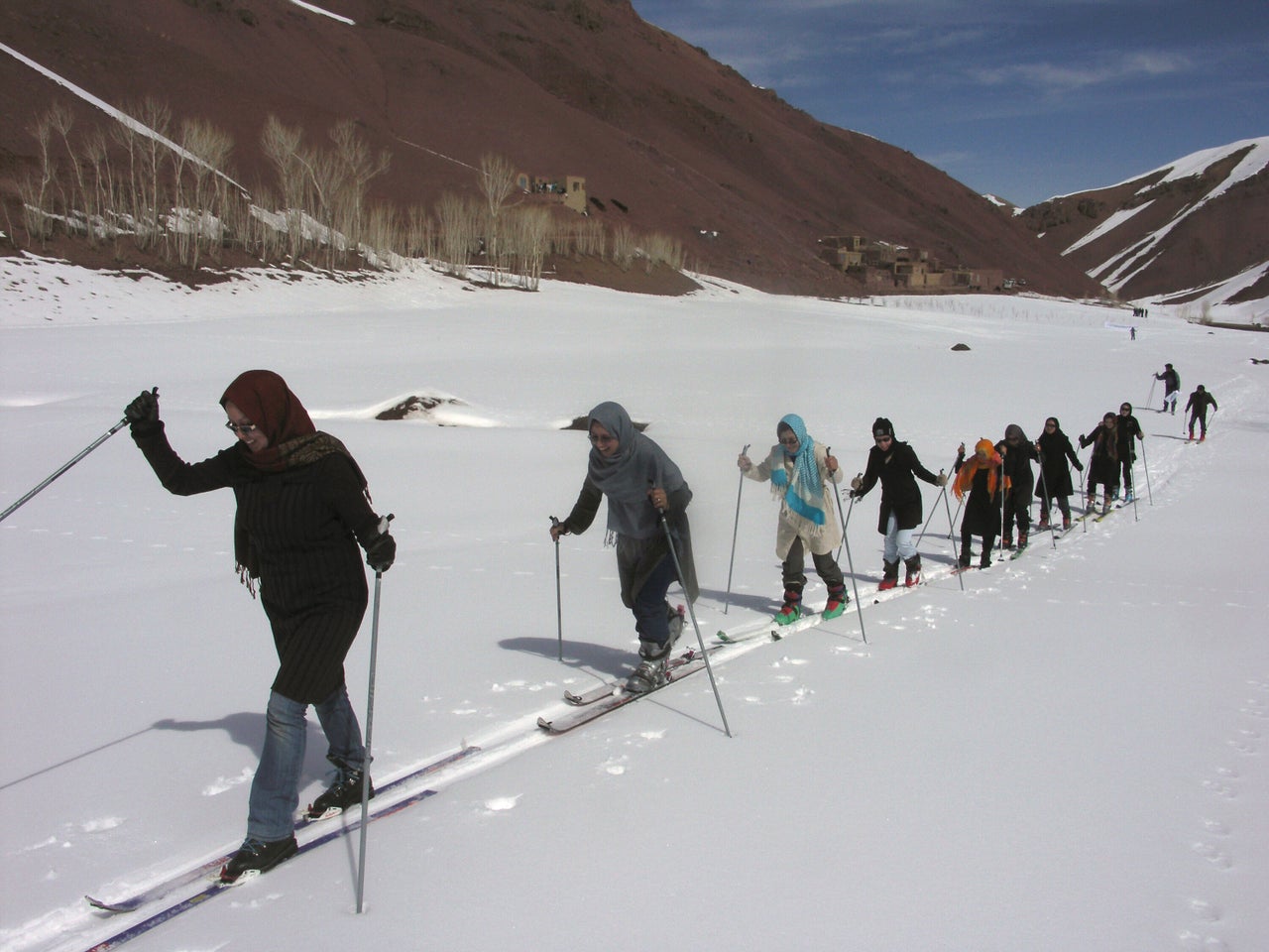 In this picture taken on March 10, 2011, people ski on the mountains in the Khoshkak village in Bamyan province.