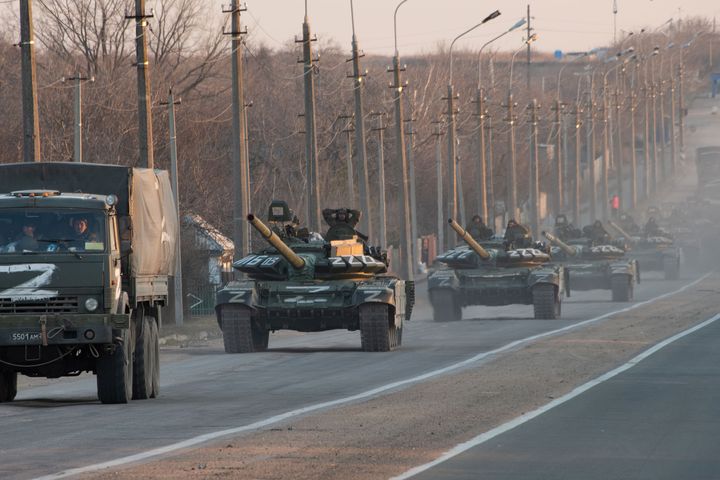 A column of tanks marked with the Z symbol stretches into the distance as they proceed northwards along the Mariupol-Donetsk highway on Wednesday.