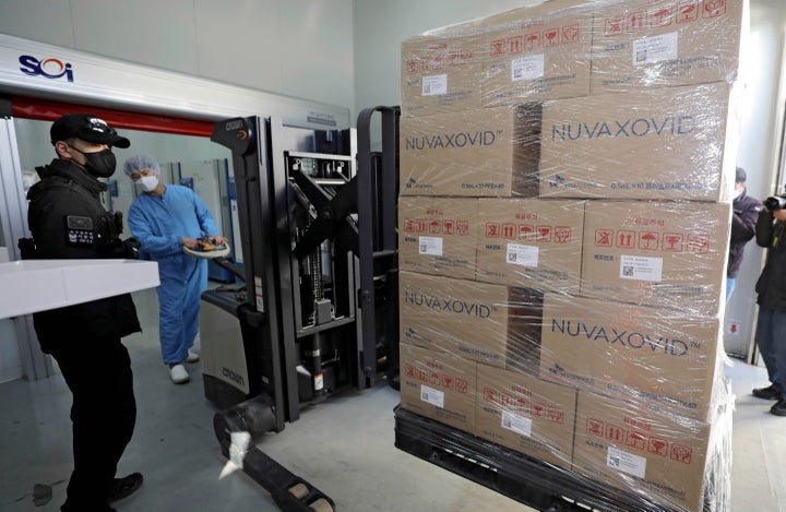 FILE - A worker moves boxes carrying Novavax's COVID-19 vaccine at SK Bioscience Co. in Andong, South Korea, on Feb. 9, 2022. Before the pandemic, Novavax was a small American company that had never brought any vaccine to market. Its shots have proven highly effective, but it is relying heavily on other companies to make them. (Kim Hyun-tae/Yonhap via AP, File)