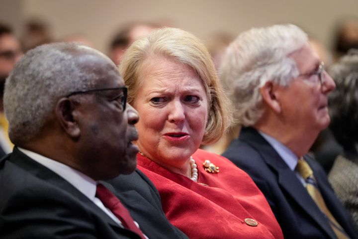 Supreme Court Justice Clarence Thomas with his wife and conservative activist Ginni Thomas while he waits to speak Oct 21, 2021, at the Heritage Foundation in Washington, D.C.