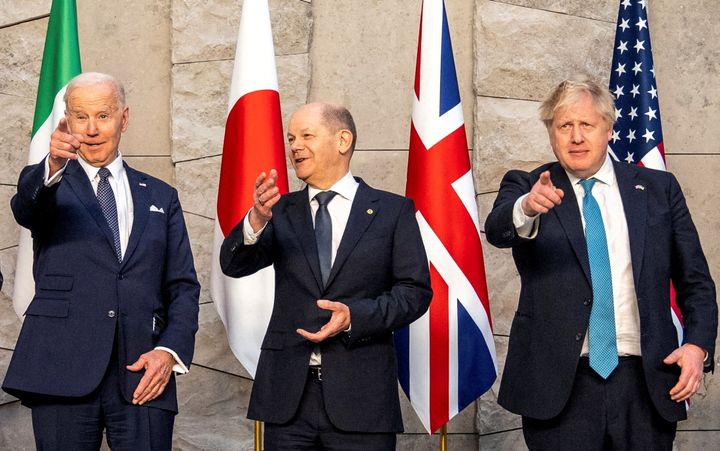 U.S. President Joe Biden, German Chancellor Olaf Scholz and Britain's Prime Minister Boris Johnson pose for a family photo during the G7 summit in Brussels, Belgium, on March 24, 2022. 