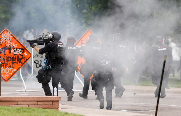 Denver police fire tear gas canisters during a protest outside the Colorado state Capitol over the death of George Floyd, in this file photograph taken on May 30, 2020.