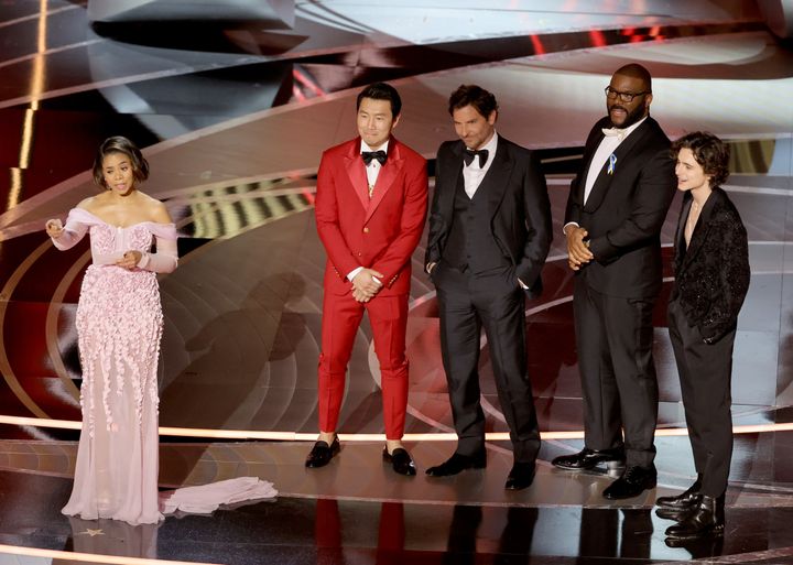 Co-host Regina Hall, Simu Liu, Bradley Cooper, Tyler Perry and Timothée Chalamet are seen onstage.
