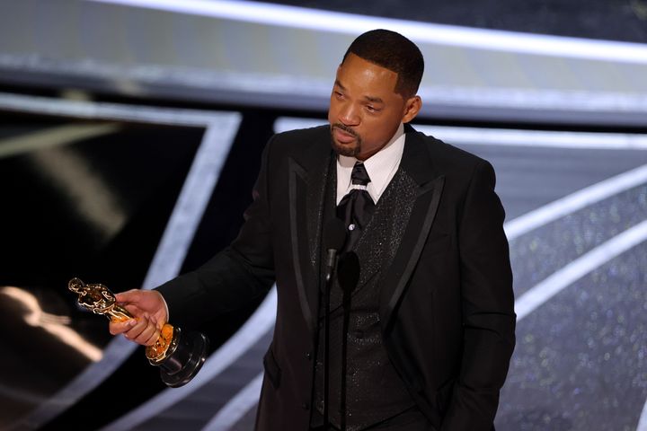 A tearful Will Smith accepts his Oscar