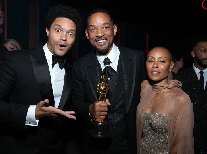 Trevor Noah mugs for the camera with Will Smith and Jada Pinkett Smith at the Vanity Fair bash.