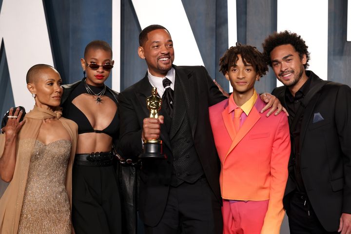 Will Smith puts his arm around son Jaden Smith in a family photo at the Vanity Fair Oscar Party.