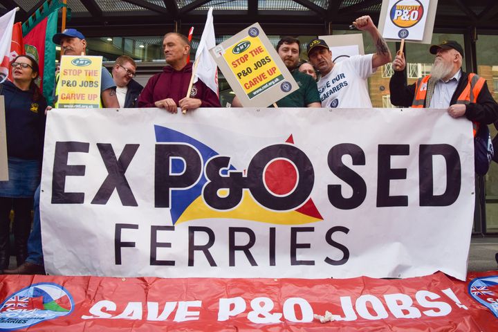 Protesters hold a banner critical of P&O Ferries during the demonstration outside DP World headquarters. (Photo by Vuk Valcic/SOPA Images/LightRocket via Getty Images)