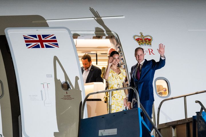 William and Kate wave as they board a plane in the Bahamas on March 26. 